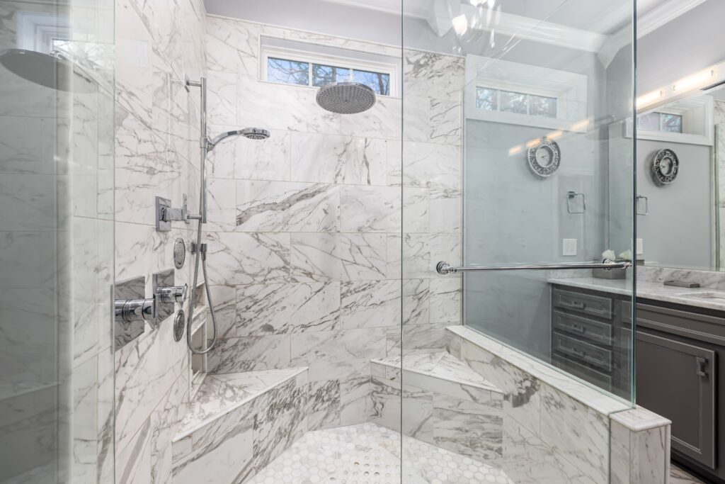 marble shower with framless glass 