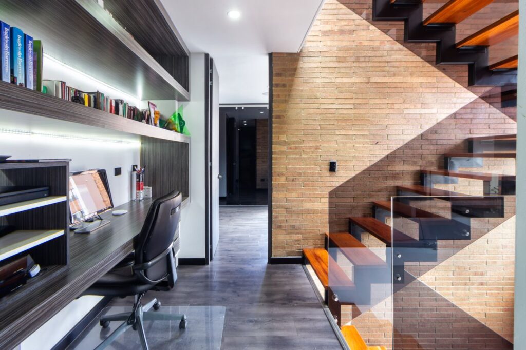 modern styled home with frameless glasss staircase 